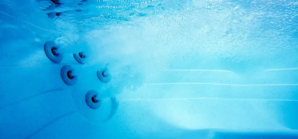 Underwater shot of a swim spa with cloudy water.